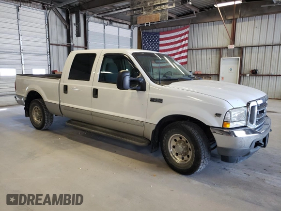 2002 Ford F-250 XL with VIN 1FTNW20S72EB45107, listed as a Copart auction lot 69238304 with 205,294 mi miles and Salvage Title. Bid and sale history available at DreamBid. Image 4.