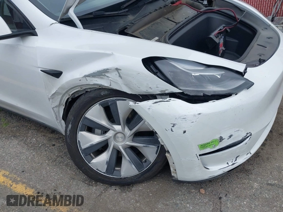 2023 Tesla Model Y Long Range with VIN 7SAYGAEE9PF702910, listed as a IAAI auction lot 42199519 with 91,094 mi miles and . Bid and sale history available at DreamBid. Image 19.