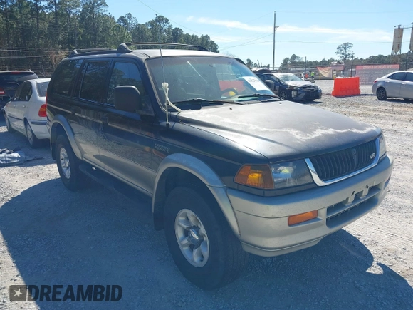 1999 Mitsubishi Montero LS z VIN JA4LS31H7XP018312, wystawiony jako IAAI lot #41827943 z przebiegiem 204 814 mil mil oraz . Historia ofert i sprzedaży dostępna na DreamBid. Obrazek 1.