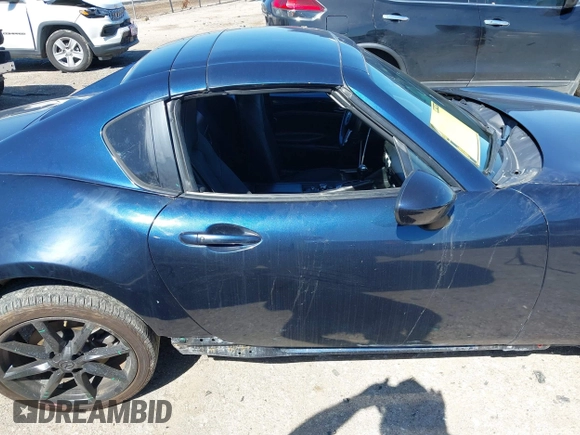 2021 Mazda MX-5 Miata Grand Touring with VIN JM1NDAM7XM0455743, listed as a IAAI auction lot 42067373 with 28,255 mi miles and . Bid and sale history available at DreamBid. Image 13.