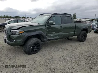 2021 Toyota Tacoma SR5 with VIN 3TMDZ5BN1MM103735, listed as a Copart auction lot 59218305 with 50,482 mi miles and Salvage title. Bid and sale history available at DreamBid. Image 1.