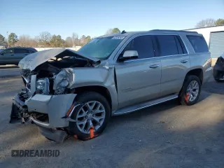 2015 GMC Yukon SLE with VIN 1GKS1AKC4FR265208, listed as a Copart auction lot 42324245 with 105,760 mi miles and Salvage Title. Bid and sale history available at carsss.com. Image 1.