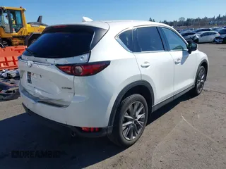 2021 Mazda CX-5 Grand Touring with VIN JM3KFBDM6M0483135, listed as a IAAI auction lot 41590430 with 33,466 mi miles. Bid and sale history available at carsss.com. Image 4.