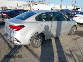 2023 Kia Rio LX with VIN 3KPA24AD1PE599290, listed as a IAAI auction lot 41023283 with 10,027 mi miles and . Bid and sale history available at DreamBid. Image 4.