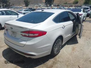 2017 Ford Fusion Titanium z VIN 3FA6P0SU0HR329224, wystawiony jako IAAI lot #42291605 z przebiegiem 176 728 mil mil oraz . Historia ofert i sprzedaży dostępna na DreamBid. Obrazek 4.