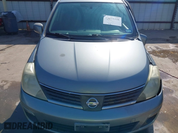 2009 Nissan Versa 1.8 SL with VIN 3N1BC13E19L372298, listed as a IAAI auction lot 42011338 with 131,882 mi miles. Bid and sale history available at carsss.com. Image 13.