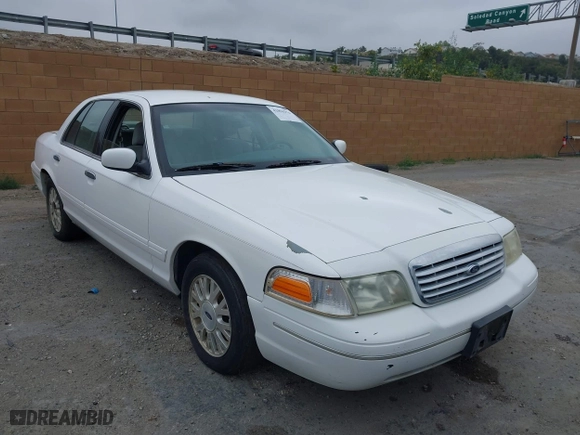 2003 Ford Crown Victoria LX with VIN 2FAFP74WX3X154904, listed as a IAAI auction lot 42094274 with 123,579 mi miles. Bid and sale history available at carsss.com. Image 1.