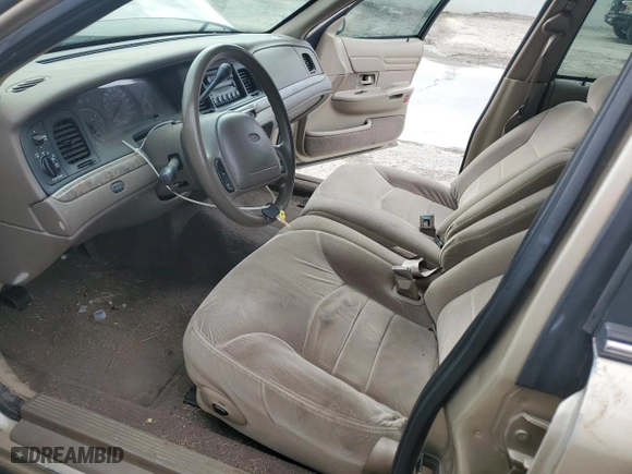 2000 Ford Crown Victoria LX with VIN 2FAFP74W7YX117705, listed as a Copart auction lot 79226944 with 128,019 mi miles and Salvage Title. Bid and sale history available at carsss.com. Image 7.
