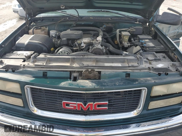 1997 GMC Sierra 1500 with VIN 1GTGC24JXVE524979, listed as a Copart auction lot 79087634 with 170,567 mi miles and Salvage Title. Bid and sale history available at DreamBid. Image 11.