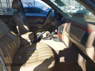 1999 Jeep Grand Cherokee Limited with VIN 1J4GW68NXXC727844, listed as a IAAI auction lot 41290773 with 222,838 mi miles. Bid and sale history available at carsss.com. Image 5.