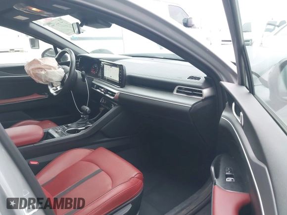 2023 Kia K5 GT-Line z VIN 5XXG64J27PG199321, wystawiony jako IAAI lot #42153677 z przebiegiem 28 798 mil mil oraz . Historia ofert i sprzedaży dostępna na DreamBid. Obrazek 5.