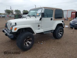 2001 Jeep Wrangler Sahara with VIN 1J4FA59S71P365271, listed as a IAAI auction lot 41889948 with 144,357 mi miles. Bid and sale history available at carsss.com. Image 2.