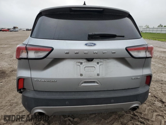 2021 Ford Escape Titanium с VIN 1FMCU9J99MUB12020, выставлен на аукционе Copart как лот 51443365 с пробегом 63 504 миль миль и Списание • Salvage title. История ставок и продаж доступна на DreamBid. Изображение 6.