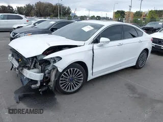 2018 Ford Fusion Titanium with VIN 3FA6P0RU0JR117158, listed as a IAAI auction lot 41435172 with 98,390 mi miles and . Bid and sale history available at DreamBid. Image 2.