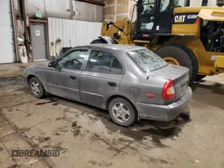 2000 Hyundai Accent z VIN KMHCG45G4YU090520, wystawiony jako Copart lot #79705864 z przebiegiem 145 490 mil mil oraz Szkoda całkowita • Salvage title. Historia ofert i sprzedaży dostępna na DreamBid. Obrazek 2.