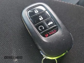 2022 Honda Civic Sport z VIN 2HGFE2F58NH586977, wystawiony jako IAAI lot #42202088 z przebiegiem 56 060 mil mil oraz . Historia ofert i sprzedaży dostępna na DreamBid. Obrazek 11.