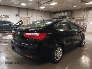 2014 Kia Rio LX with VIN KNADM4A31E6404206, listed as a IAAI auction lot 41543090 with 70,563 mi miles and . Bid and sale history available at DreamBid. Image 4.