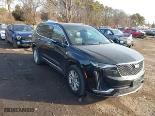2023 Cadillac XT6 Luxury with VIN 1GYKPBR41PZ136918, listed as a IAAI auction lot 41417724 with 57,949 mi miles. Bid and sale history available at carsss.com. Image 1.