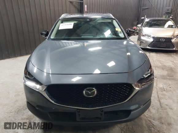 2022 Mazda CX-30 S Carbon Edition with VIN 3MVDMBCL8NM447234, listed as a IAAI auction lot 42511600 with 51,926 mi miles and . Bid and sale history available at DreamBid. Image 12.