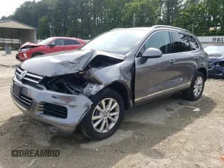 2013 Volkswagen Touareg Lux with VIN WVGEF9BP1DD001641, listed as a Copart auction lot 59971245 with 244,893 mi miles and Salvage title. Bid and sale history available at DreamBid. Image 1.