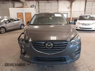 2016 Mazda CX-5 Grand Touring with VIN JM3KE2DYXG0846787, listed as a IAAI auction lot 41346364 with 113,553 mi miles. Bid and sale history available at carsss.com. Image 12.
