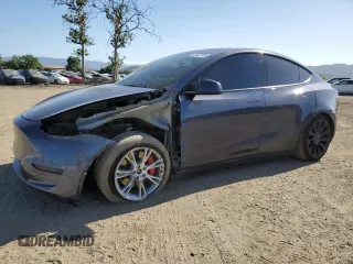 2022 Tesla Model Y Performance with VIN 7SAYGDEFXNF521502, listed as a Copart auction lot 56132745 with 73,339 mi miles and Salvage title. Bid and sale history available at DreamBid. Image 1.