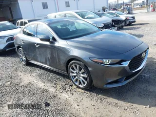 2023 Mazda 3 S Premium with VIN 3MZBPBDM8PM373434, listed as a IAAI auction lot 41234729 with 9,387 mi miles and . Bid and sale history available at DreamBid. Image 1.