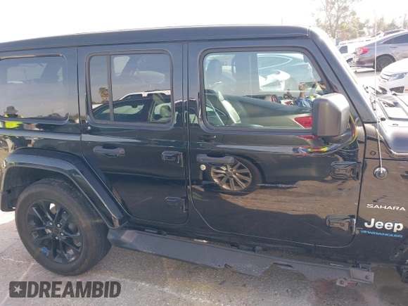 2023 Jeep Wrangler Sahara with VIN 1C4JJXP67PW556933, listed as a IAAI auction lot 41587035 with 20,463 mi miles and . Bid and sale history available at DreamBid. Image 13.