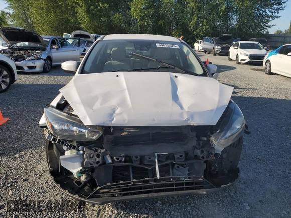 2015 Ford Focus Titanium z VIN 1FADP3N24FL262321, wystawiony jako Copart lot #59635525 z przebiegiem Nie podano mil oraz Szkoda całkowita • Salvage title. Historia ofert i sprzedaży dostępna na DreamBid. Obrazek 5.