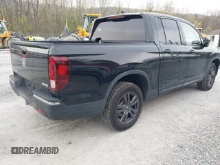 2019 Honda Ridgeline Sport with VIN 5FPYK3F10KB046552, listed as a IAAI auction lot 41983384 with 77,229 mi miles and . Bid and sale history available at DreamBid. Image 4.