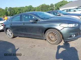 2016 Ford Fusion Titanium with VIN 3FA6P0K90GR188049, listed as a IAAI auction lot 42575477 with 239,414 mi miles and . Bid and sale history available at DreamBid. Image 13.