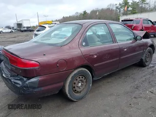 2000 Mercury Mystique GS z VIN 1MEFM6533YK613961, wystawiony jako IAAI lot #41982995 z przebiegiem 83 174 mil mil oraz . Historia ofert i sprzedaży dostępna na DreamBid. Obrazek 4.