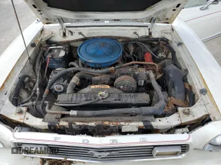 1977 Ford Mustang z VIN 7F04Z150204, wystawiony jako Copart lot #77276344 z przebiegiem 94 802 mil mil oraz Szkoda całkowita • Salvage title. Historia ofert i sprzedaży dostępna na DreamBid. Obrazek 11.