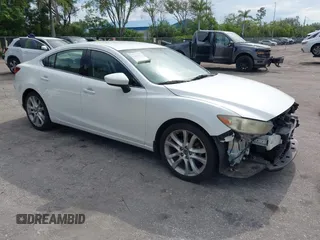 2014 Mazda 6 i Touring with VIN JM1GJ1V64E1147289, listed as a IAAI auction lot 42593747 with 136,973 mi miles and . Bid and sale history available at DreamBid. Image 1.