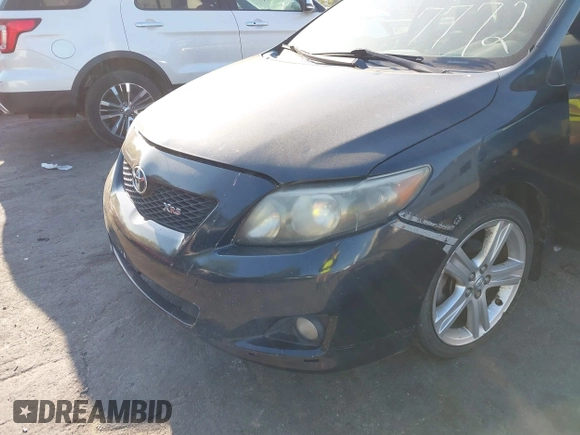2009 Toyota Corolla XRS with VIN 1NXBE40E59Z003796, listed as a IAAI auction lot 42077772 with 215,159 mi miles. Bid and sale history available at carsss.com. Image 6.