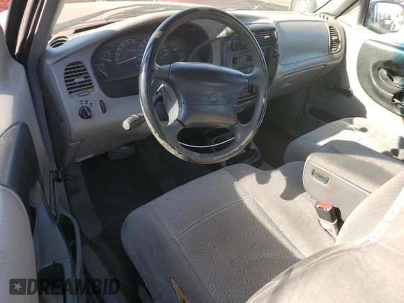 1999 Mazda B-Series 2WD Truck SE with VIN 4F4YR16V0XTM10024, listed as a Copart auction lot 82905694 with 163,025 mi miles and Salvage Title. Bid and sale history available at carsss.com. Image 8.