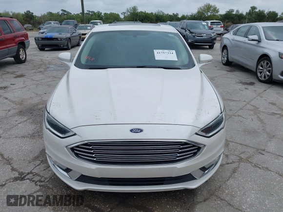 2017 Ford Fusion Titanium with VIN 3FA6P0K99HR272713, listed as a IAAI auction lot 41757334 with 104,733 mi miles. Bid and sale history available at carsss.com. Image 12.