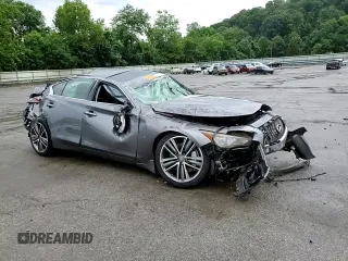 2015 Infiniti Q50 Premium с VIN JN1BV7AR4FM409526, выставлен на аукционе Copart как лот 64749215 с пробегом 82 952 миль миль и Списание • Salvage title. История ставок и продаж доступна на DreamBid. Изображение 14.