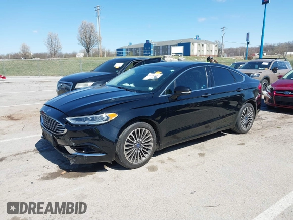 2017 Ford Fusion SE z VIN 3FA6P0HD1HR138693, wystawiony jako IAAI lot #41837634 z przebiegiem 117 638 mil mil oraz . Historia ofert i sprzedaży dostępna na DreamBid. Obrazek 2.