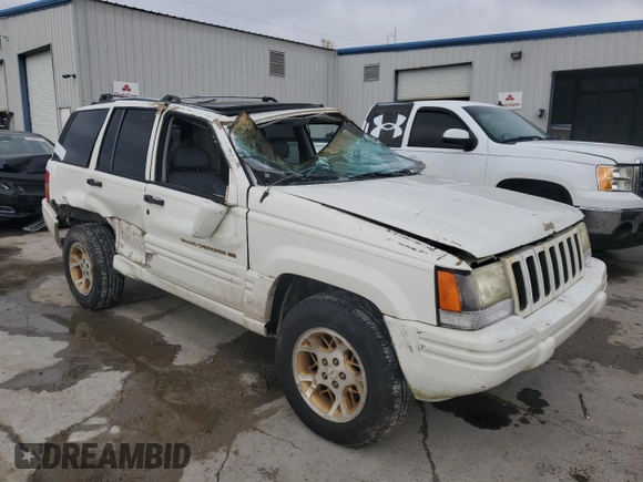1997 Jeep Grand Cherokee Limited with VIN 1J4GX78YXVC716353, listed as a Copart auction lot 85207974 with 115,527 mi miles and Salvage Title. Bid and sale history available at carsss.com. Image 4.