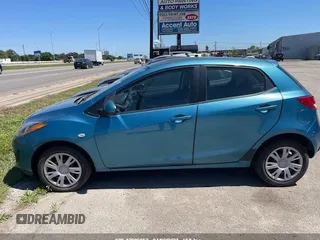 2011 Mazda 2 Sport with VIN JM1DE1HY7B0116561, listed as a IAAI auction lot 42006952 with 139,369 mi miles. Bid and sale history available at carsss.com. Image 12.