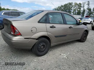 2004 Ford Focus LX with VIN 1FAFP33P24W148563, listed as a Copart auction lot 63869755 with 142,243 mi miles and Salvage title. Bid and sale history available at DreamBid. Image 3.