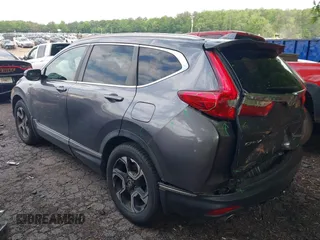 2018 Honda CR-V Touring z VIN 7FARW1H9XJE040530, wystawiony jako IAAI lot #42227446 z przebiegiem 101 299 mil mil oraz . Historia ofert i sprzedaży dostępna na DreamBid. Obrazek 14.