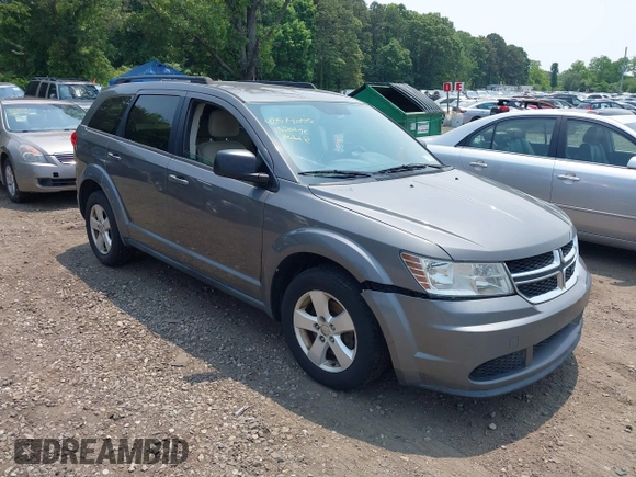 2013 Dodge Journey American Value z VIN 3C4PDCAB0DT691429, wystawiony jako IAAI lot #42514055 z przebiegiem 213 593 mil mil oraz . Historia ofert i sprzedaży dostępna na DreamBid. Obrazek 1.