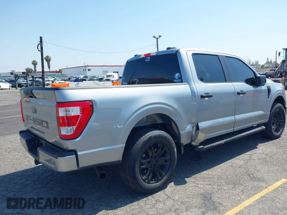 2023 Ford F-150 XL with VIN 1FTEW1CP0PKG14886, listed as a IAAI auction lot 42444367 with 10,677 mi miles and . Bid and sale history available at DreamBid. Image 4.