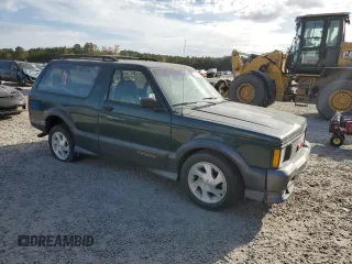 1993 GMC Jimmy z VIN 1GDCT18Z9P0810178, wystawiony jako Copart lot #79442614 z przebiegiem 19 514 mil mil oraz Szkoda całkowita • Salvage title. Historia ofert i sprzedaży dostępna na DreamBid. Obrazek 4.