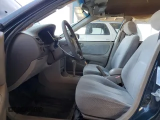 1999 Toyota Corolla VE z VIN 1NXBR12E6XZ286383, wystawiony jako Copart lot #64007215 z przebiegiem 176 069 mil mil oraz Czysty tytuł • Clean title. Historia ofert i sprzedaży dostępna na DreamBid. Obrazek 7.