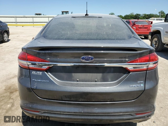 2017 Ford Fusion Hybrid SE с VIN 3FA6P0LU2HR258767, выставлен на аукционе Copart как лот 58069375 с пробегом 152 049 миль миль и Списание • Salvage title. История ставок и продаж доступна на DreamBid. Изображение 6.