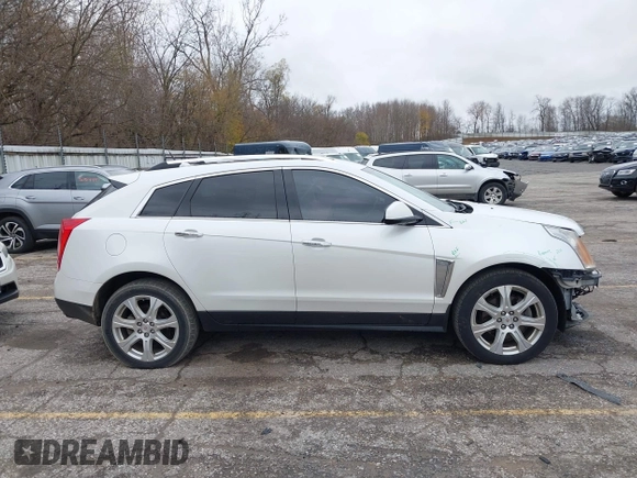 2014 Cadillac SRX Premium Collection z VIN 3GYFNDE34ES548826, wystawiony jako IAAI lot #40792942 z przebiegiem 115 984 mil mil oraz . Historia ofert i sprzedaży dostępna na DreamBid. Obrazek 14.