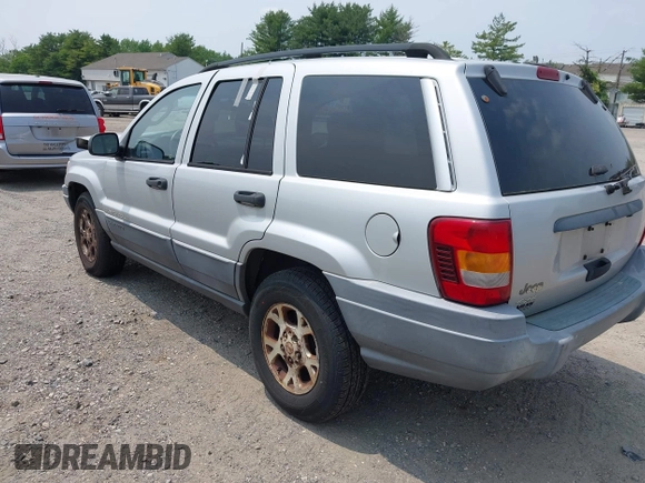 2002 Jeep Grand Cherokee Laredo with VIN 1J4GW48SX2C313093, listed as a IAAI auction lot 42446559 with 200,319 mi miles and . Bid and sale history available at DreamBid. Image 3.